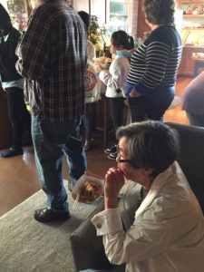 Overflow crowd listening from inside the Fadelli home