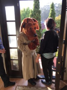 Volunteer Crime-Stopper McGruff welcoming people at the door.